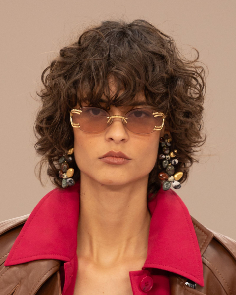 Closeup shot of a runway model with an '80s shaggy bob
